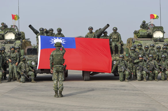 Taiwanese soldiers pose for a photo after military exercises in January which simulated a possible intrusion by Beijing. Taiwan, like Ukraine, will seek robust support from the West if China acts.