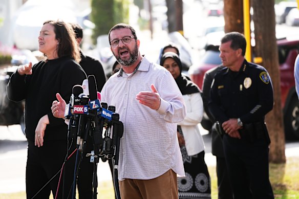 Taha Hassane, imam for the Islamic Centre of San Diego, speaks outside the mosque.