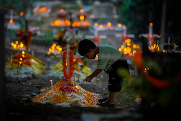 deceased relative during All Souls Day, in Guwahati, India.