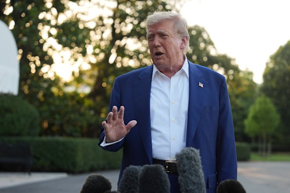 President Donald Trump speaks with reporters before heading to The Hague.