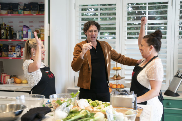 MKR contestants Jenni and Louise in the kitchen with Colin Fassnidge.