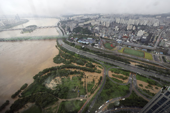 A part of a main road near the Han River is flooded due to heavy rain in Seoul, South Korea.
