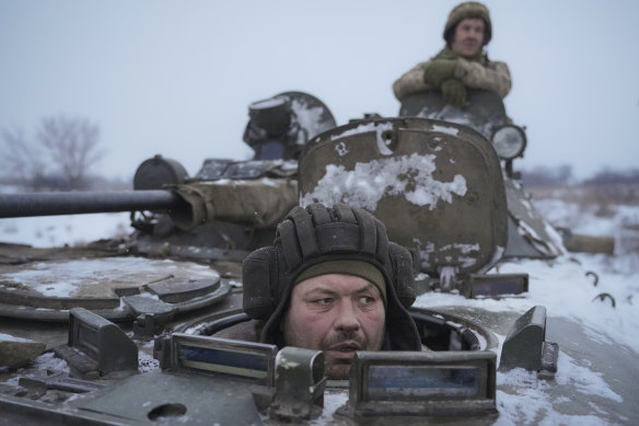 A Ukrainian solider in an armoured personnel carrier near the front line in the Luhansk area, eastern Ukraine,