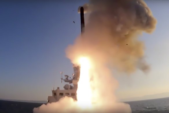 A Russian warship fires a cruise missile at a target in Ukraine.