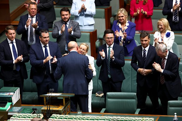 Peter Dutton is congratulated by his then deputy Sussan Ley and applauded by Nationals leader David Littleproud after delivering his budget reply speech on March 27. 