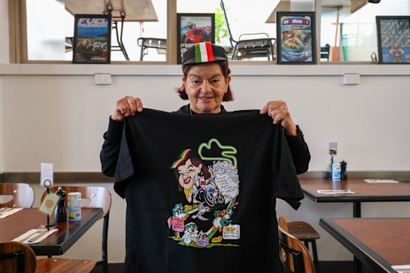 Rosa Scarlato shows off an exclusive T-shirt design made by her kids for MotoGP weekend.