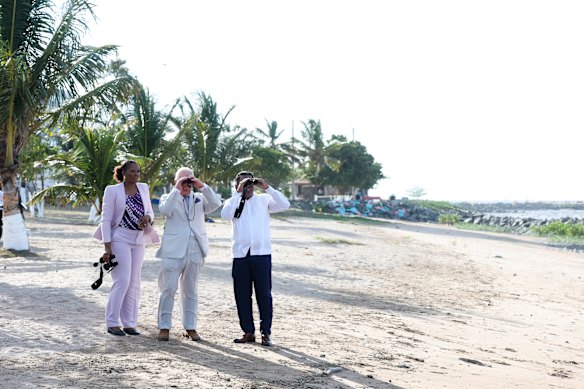 The King with Guyana’s Minister of Agriculture Minister, Zulfikar Mustapha,  and Mangroves Restoration and Management project coordinator Kene Moseley at the Kingston Seawall Esplanade in Georgetown.