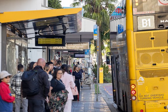 Commuters queue for a B-line bus at Dee Why on Monday morning.