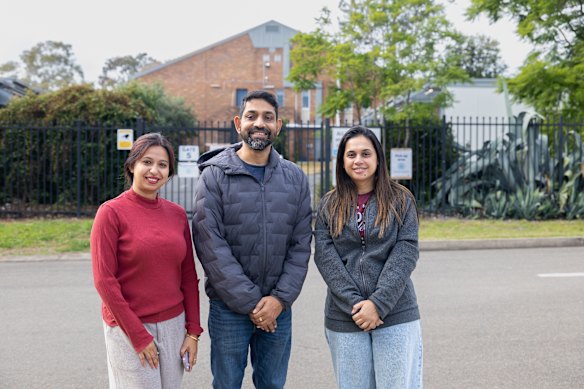 Kuntal and Nita Ghoshal, and their friend Manali Panchal outside Castle Hill High School on Friday.