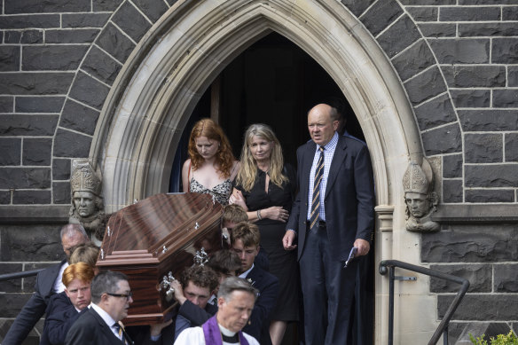 Friends carry Edward Millear’s coffin out of the church as his parents, Spencer and Dimity, and sister Eleanor watch.