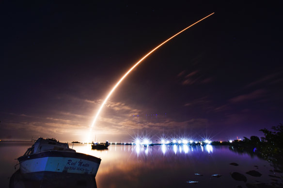 A SpaceX Falcon 9 rocket launches from Pad 39-A at Kennedy Space Centre carrying a batch of Starlink internet satellites.