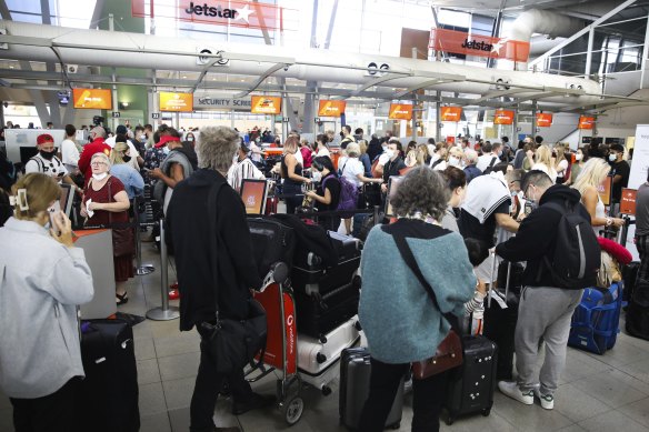 Thousands of people queued for hours waiting to check in at Sydney Airport during the April school holidays.
