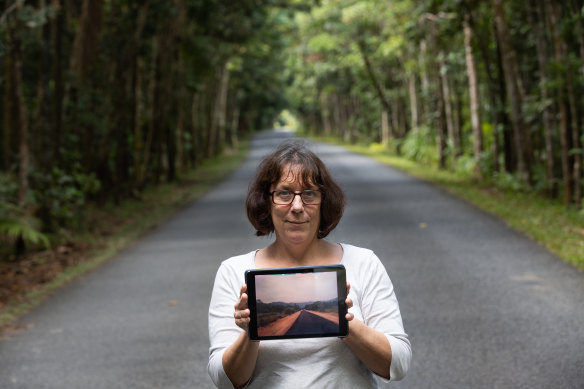 Local Connie Pinson holds a photo of the same road from 1970s to illustrate the impact of tree planting by the local community. This is not an image being shared by the charities.