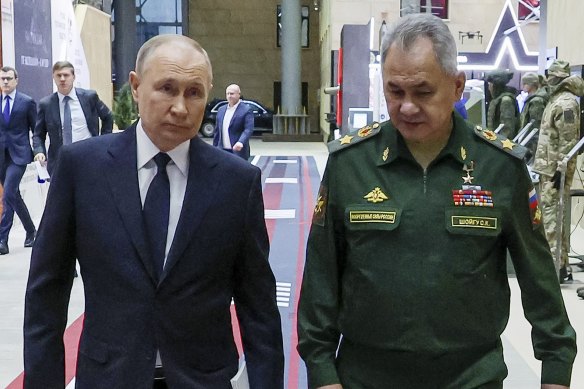 Russian President Vladimir Putin, left, and then Russian Defence Minister Sergei Shoigu attend a meeting with the top military brass in Moscow, Russia. 