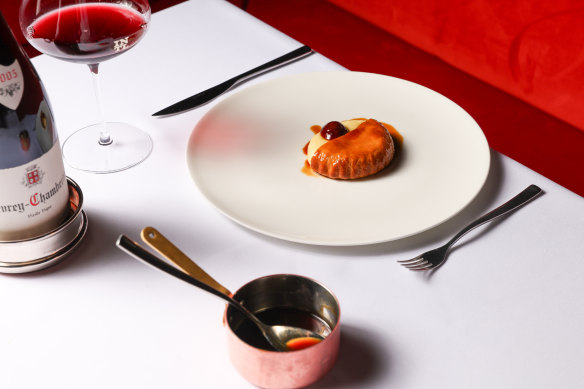 Quail pie wrapped in suet pastry with roasted cherries and Madeira sauce.