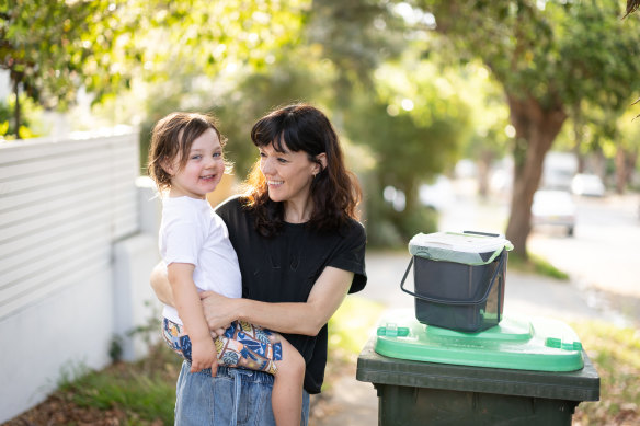 Michelle Gray and her son Harry with their FOGO bin in Rose Bay.