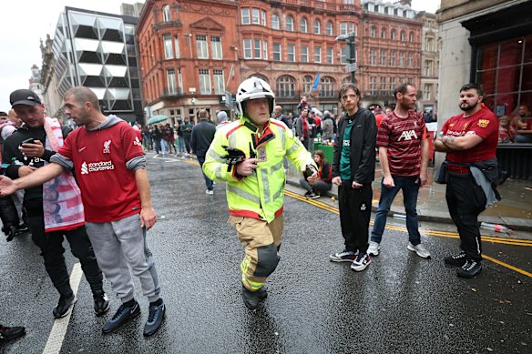Emergency services react in the aftermath of the incident during the Liverpool victory parade.