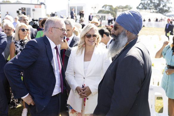 Prime Minister Anthony Albanese speaks with 2023 Australian of the Year Taryn Brumfitt and 2023 Australia’s Local Hero Amar Singh during the flag raising and citizenship ceremony at Rond Terrace in Canberra.