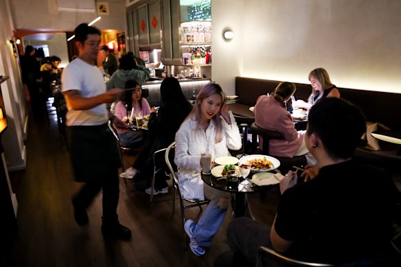Charcoal and concrete-grey colours are softened by low ambient lighting.