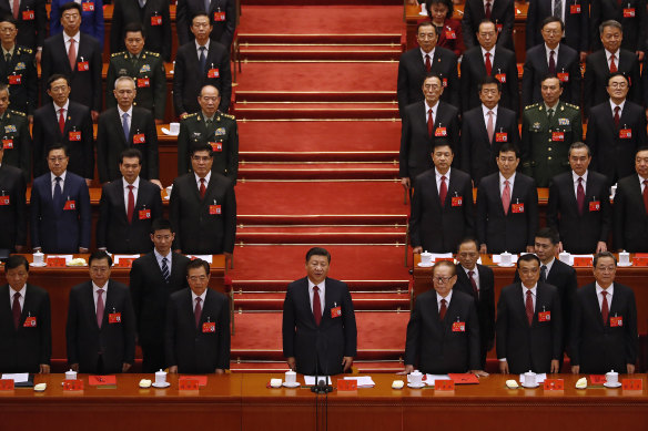 Chinese President Xi Jinping (centre) and his cadres sing the Communist song during the closing ceremony for the 19th Party Congress.