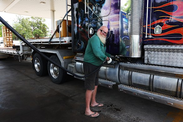 Truck driver Chris Gibbs, filling his 900-litre tank, cannot avoid the steep increase in diesel prices. 