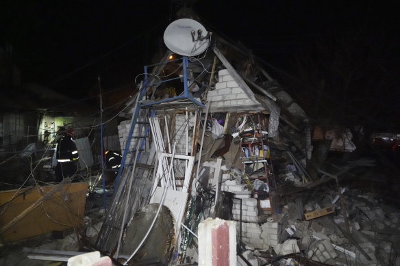 Rescue workers clear the rubble of a house destroyed in a Russian strike on a residential neighbourhood of Kharkiv on Saturday.