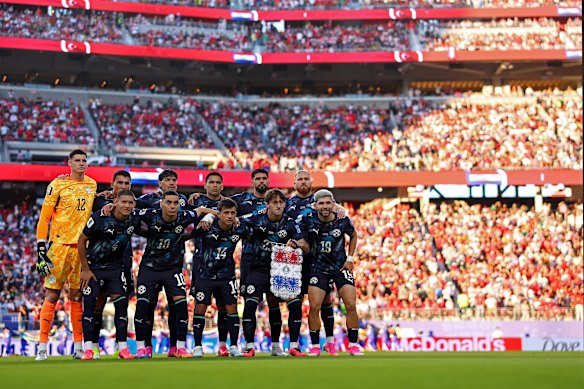 Paraguay players pose before their match against Turkey. 