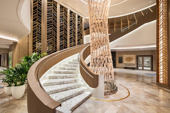 The Atrium’s curved staircase and crystal chandelier. 