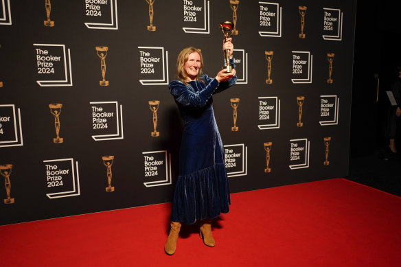 Samantha Harvey poses with the trophy after winning the Booker Prize.