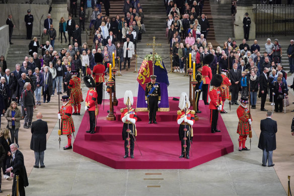 Members of the public file past as King Charles III, Anne, Princess Royal, Prince Andrew, Duke of York and Prince Edward, Earl of Wessex hold a vigil beside the coffin of their mother, Queen Elizabeth II.