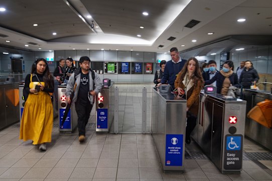 Commuters move through Green Square train station last week.