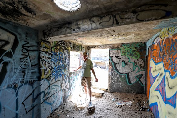 Inside one of the graffiti-covered military structures. Sutherland and other locals want the area’s history preserved.