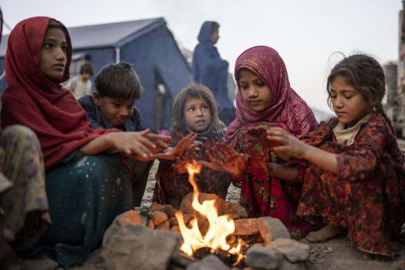 Afghan refugee children warm themselves with fire in a camp near the Pakistan-Afghanistan border. It’s almost winter in Afghanistan – when temperatures in some areas regularly plummet to as low as minus 20 degrees.