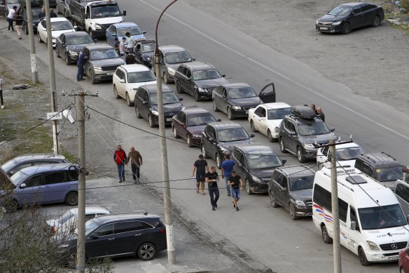 Cars queuing toward the border crossing at Verkhny Lars between Russia and Georgia, leaving Chmi, North Ossetia - Alania Republic, in Russia.