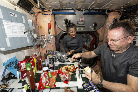 While we’re here … NASA astro<em></em>nauts Suni Williams and Butch Wilmore make pizza aboard the Internatio<em></em>nal Space Station. Items are attached to the galley using tape and velcro to keep them from flying away in the micro-gravity environment.