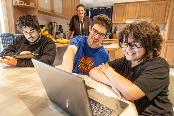 Chantal Spada and her kids, Christian (left), Antonio and Julian had to trek to their library to complete their homework.