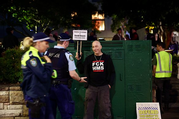 A lone counter-protester stood outside the forum.