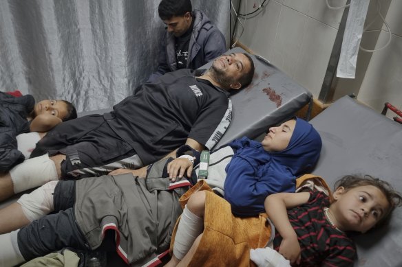 Injured Palestinians wait for treatment at the hospital following the airstrikes in Khan Younis, southern Gaza Strip on Tuesday.