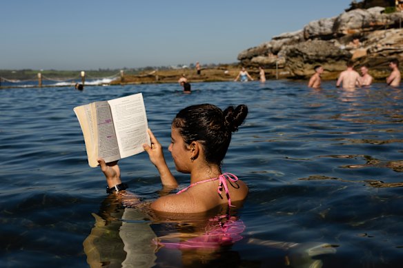 Tiana Milosevska reads in Mahon Pool, Maroubra, on an unusually hot day in April.