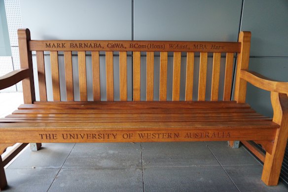 A bench at UWA engraved with the steering committee chair’s name.