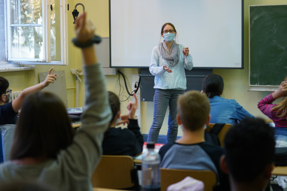 A teacher wears a face mask at a school in Berlin, Germany. 