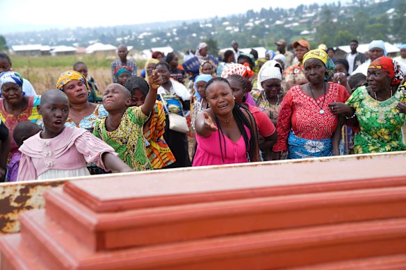Relatives cry during the burial ceremony of Abineno Justine, a 38-year-old woman who died of the Ebola virus, in Bunia, Congo, earlier this month.