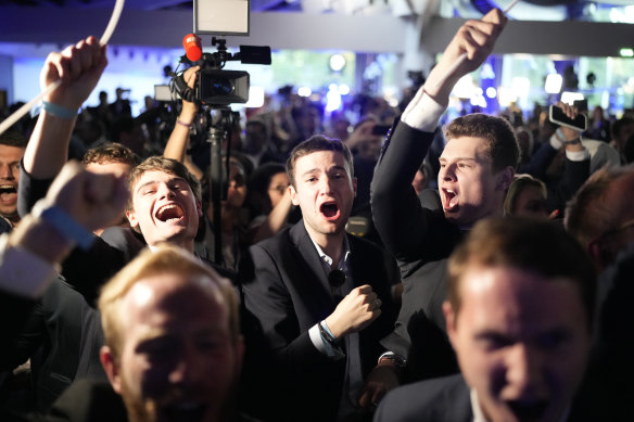Supporters of French far-right National Rally react at the party election night headquarters earlier this month.