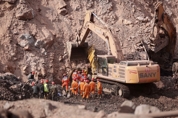 Rescuers work at the site of a collapsed open pit coal mine in Alxa League in northern China’s Inner Mongolia Autonomous Region.