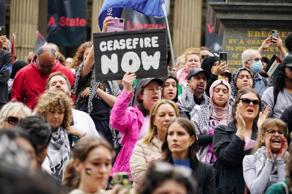 Pro-Palestine supporters march during a rally in Melbourne on Sunday.