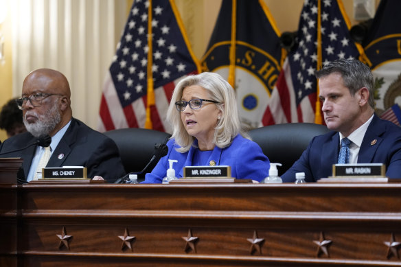 Republican Liz Cheney gives her opening remarks as Democrat Bennie Thompson, left, and Republican Adam Kinzinger look on, at the first public hearing of the House select committee investigating the US Capitol.