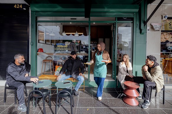Smeed cafe owner Serena Tajjour with customers. 