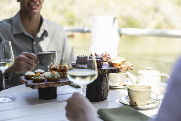 Wine tastings and afternoon teas are served overlooking a lake.