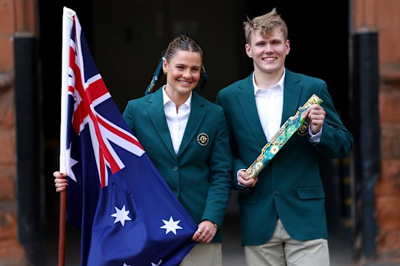 Australian flag and baton bearers Nina Kennedy and Timothy Hodge. 