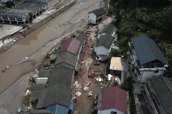 An aerial view of damaged houses at a village following a flood in Xiangxi, in central China’s Hunan Province, on July 2.